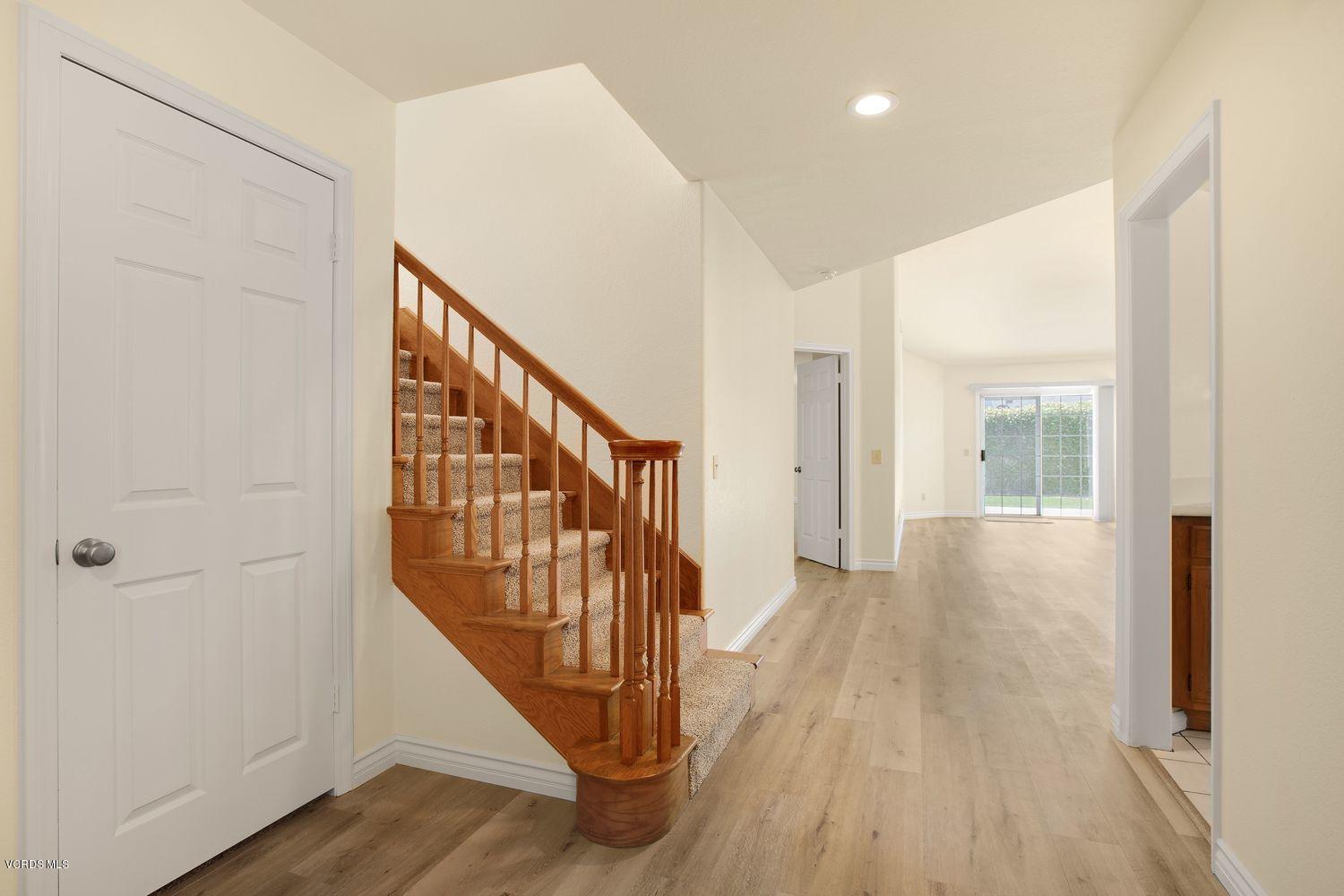 2188 Eastridge Loop Oxnard, CA 93036 - Photo 3 of 27 a view of an entryway with wooden floor