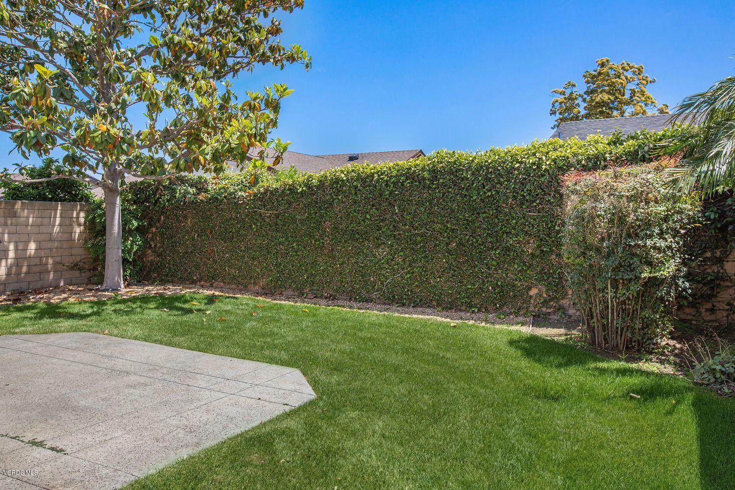 2188 Eastridge Loop Oxnard, CA 93036 - Photo 22 of 27 a view of a yard with a tree