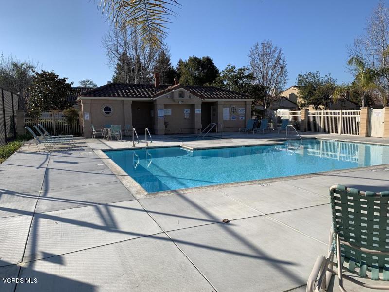 2188 Eastridge Loop Oxnard, CA 93036 - Photo 26 of 27 a front view of a house with garden