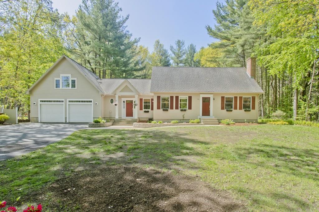 201 Plumtree Road Sunderland, MA 01375 - Photo 1 of 38 a front view of a house with a garden and porch