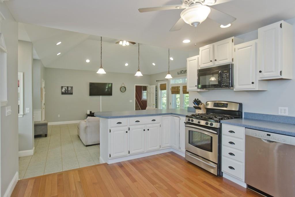 201 Plumtree Road Sunderland, MA 01375 - Photo 12 of 38 a kitchen with stainless steel appliances granite countertop a stove and a white cabinets