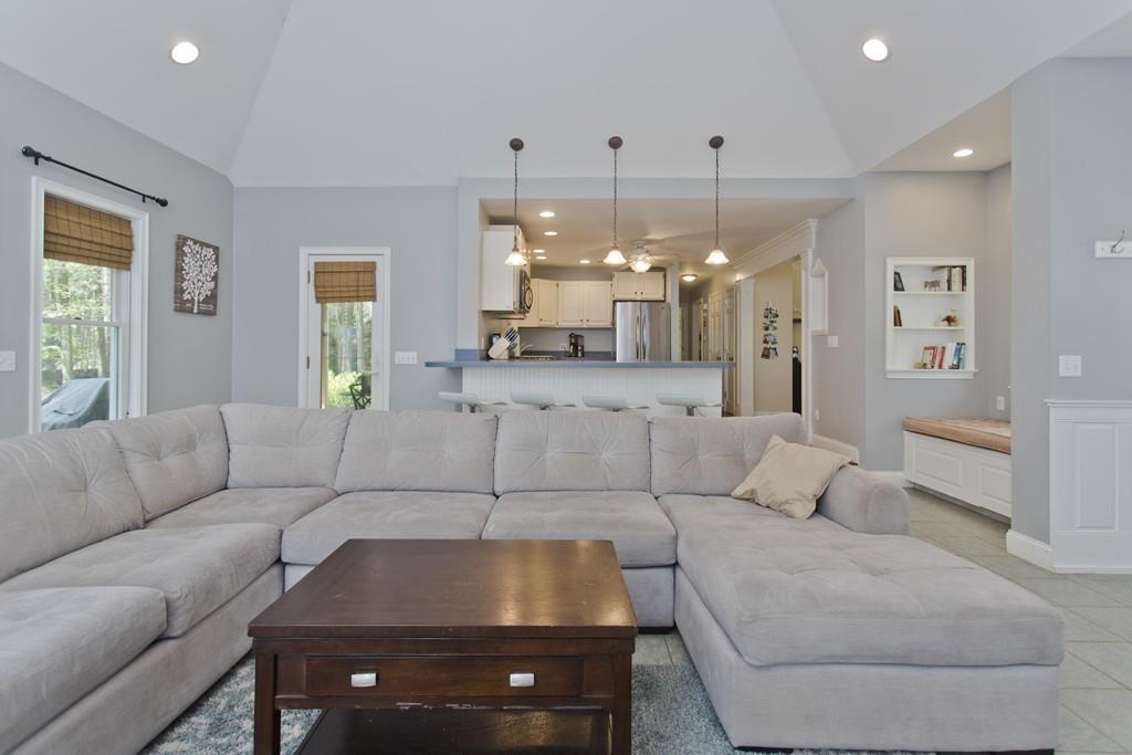 201 Plumtree Road Sunderland, MA 01375 - Photo 14 of 38 a living room with furniture and a chandelier