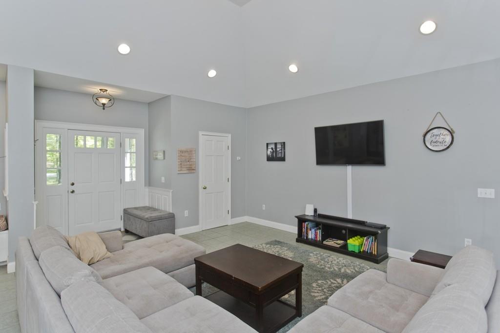 201 Plumtree Road Sunderland, MA 01375 - Photo 17 of 38 a living room with furniture and a flat screen tv