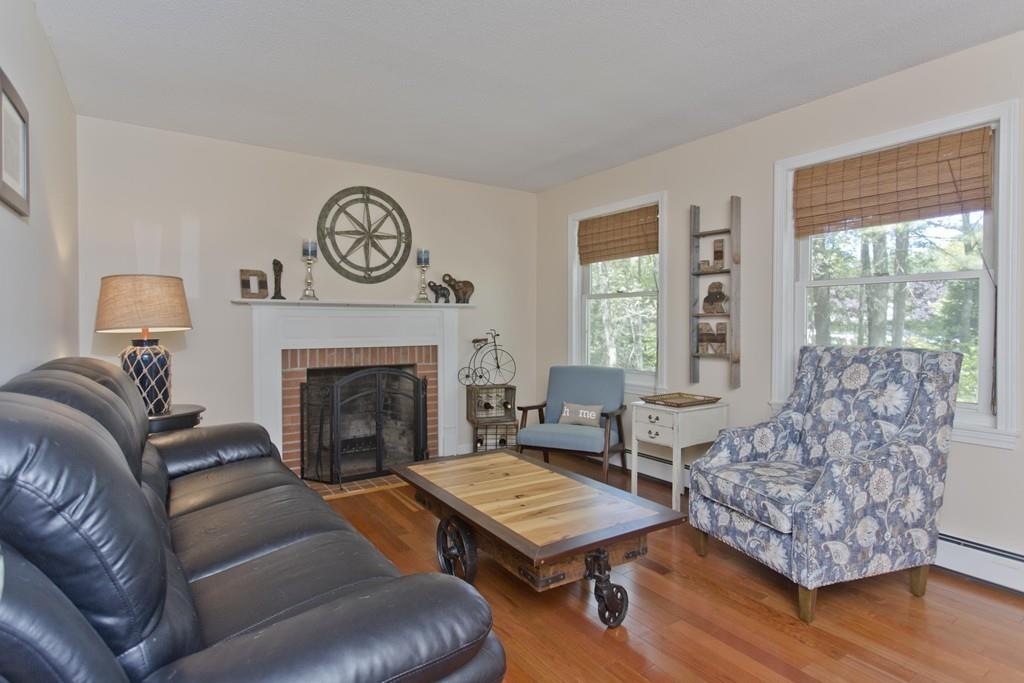 201 Plumtree Road Sunderland, MA 01375 - Photo 21 of 38 a living room with furniture and a fireplace