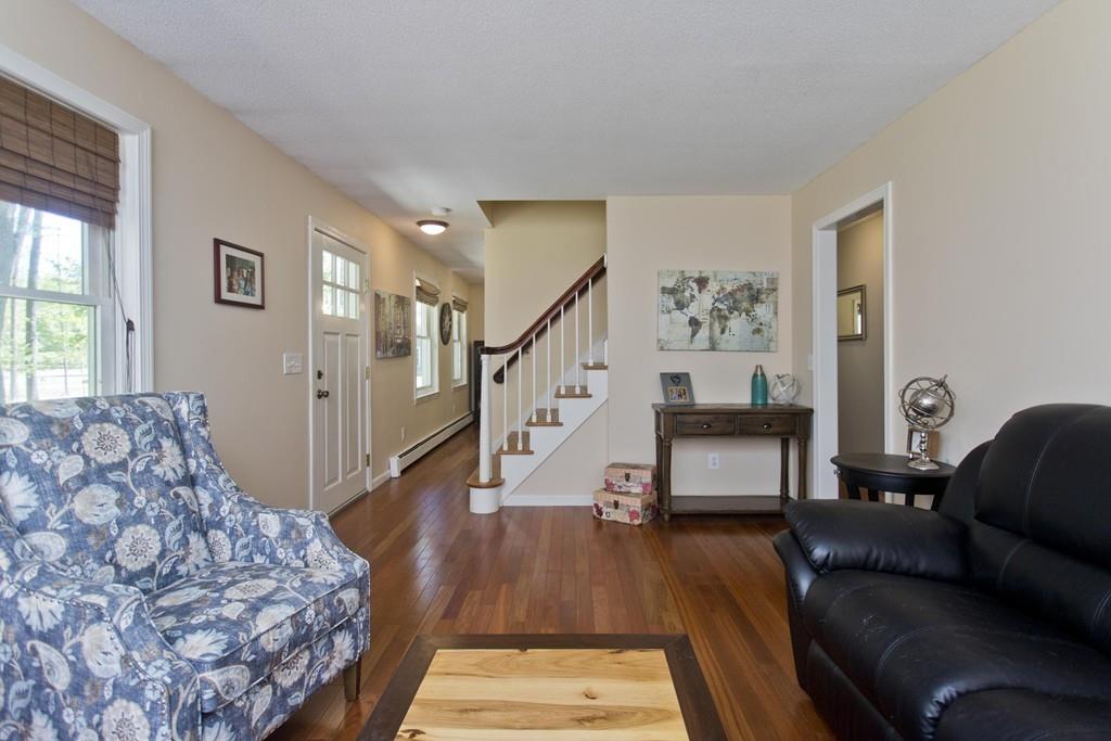 201 Plumtree Road Sunderland, MA 01375 - Photo 22 of 38 a living room with furniture and a wooden floor