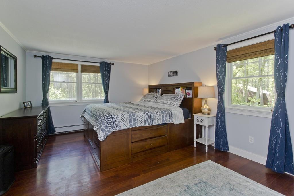 201 Plumtree Road Sunderland, MA 01375 - Photo 29 of 38 a bedroom with a bed and wooden floor