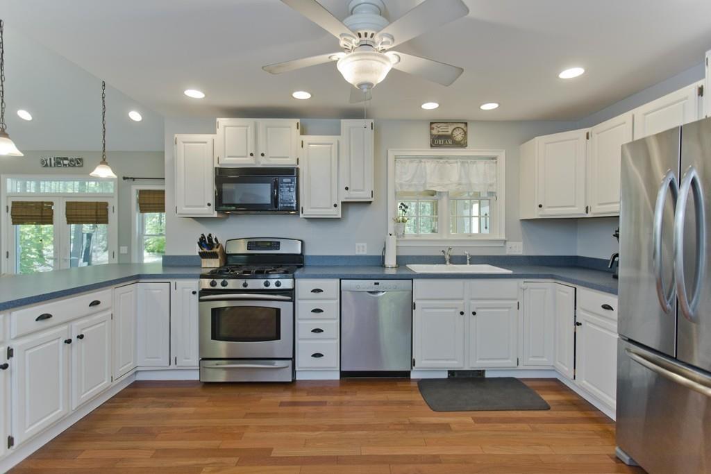 201 Plumtree Road Sunderland, MA 01375 - Photo 10 of 38 a kitchen with stainless steel appliances granite countertop a stove a sink and a refrigerator