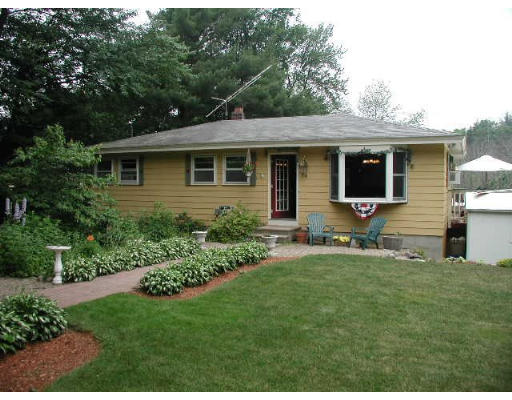 74 Longley Road Shirley, MA 01464 - Photo 1 of 4 a front view of a house with a yard