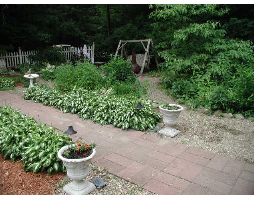 74 Longley Road Shirley, MA 01464 - Photo 4 of 4 a view of a backyard with garden and plants