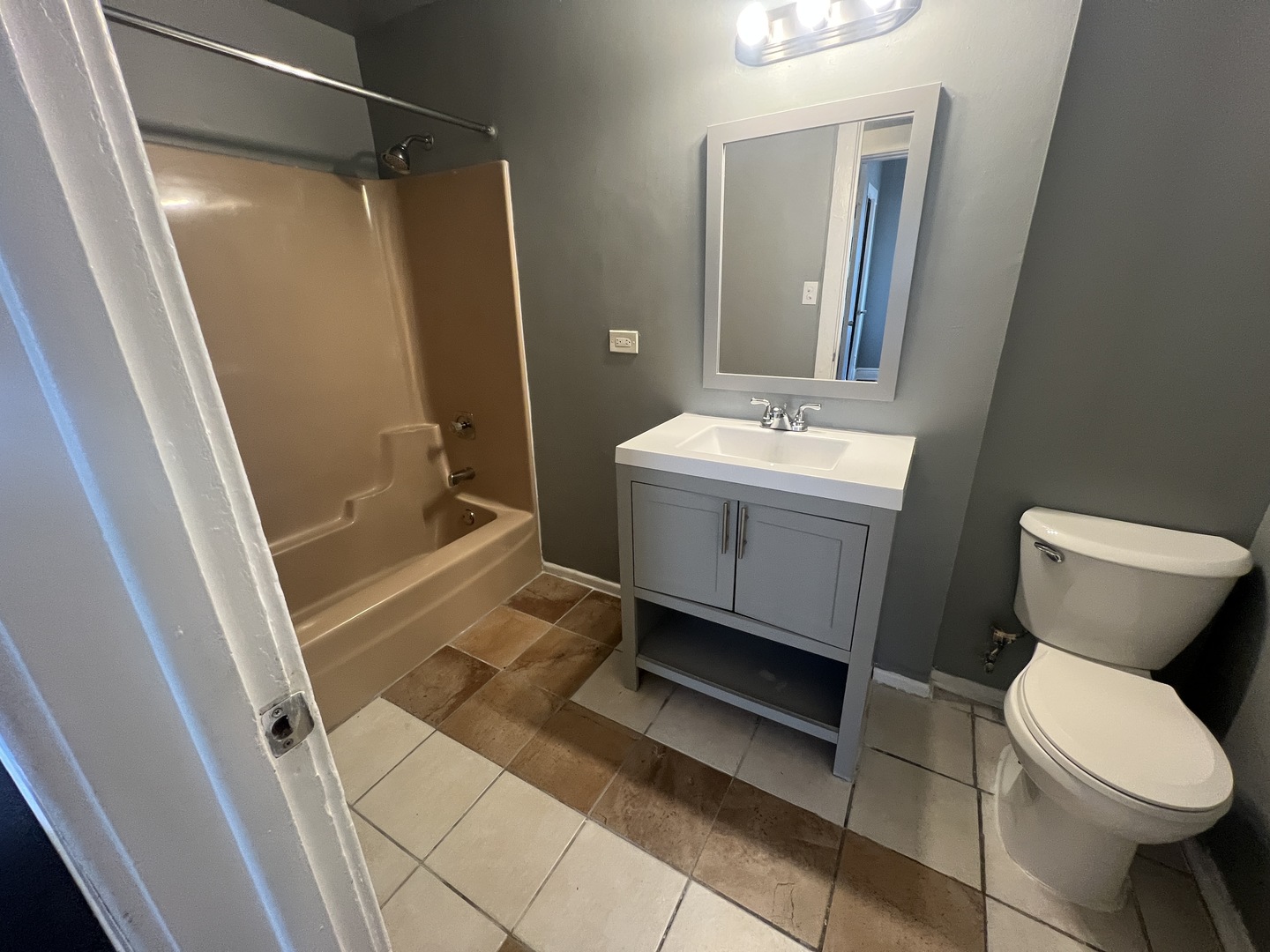 734 East 95th Street, Unit 1E Chicago, IL 60619 - Photo 7 of 7 a bathroom with a sink toilet and shower
