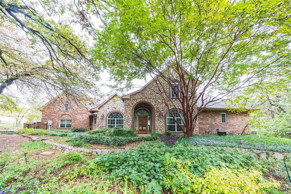 1190 Emerald Sound Boulevard Oak Point, TX 75068 - Photo 1 of 37 a front view of a house with garden