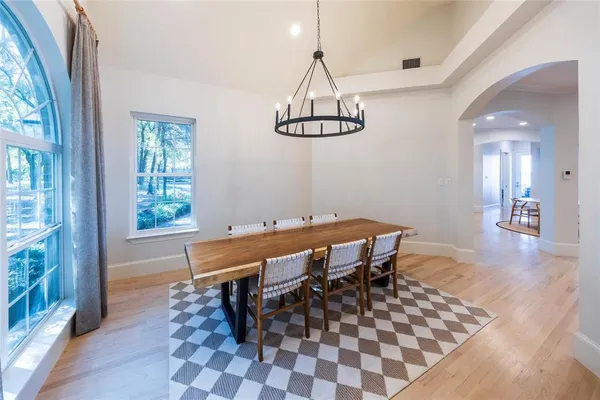 a dining room with a table and chairs
