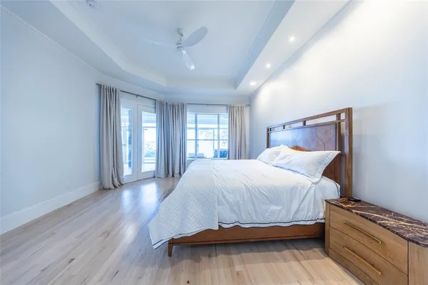 a bedroom with bed and window