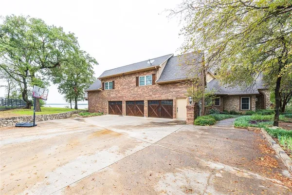 a bedroom with furniture and large window