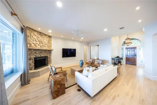 a living room with furniture and a fireplace