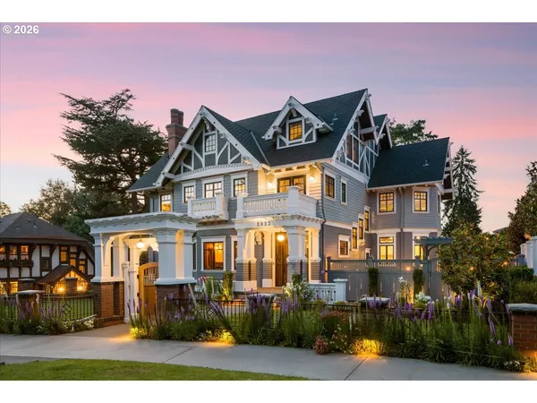 a front view of a residential apartment building with a yard