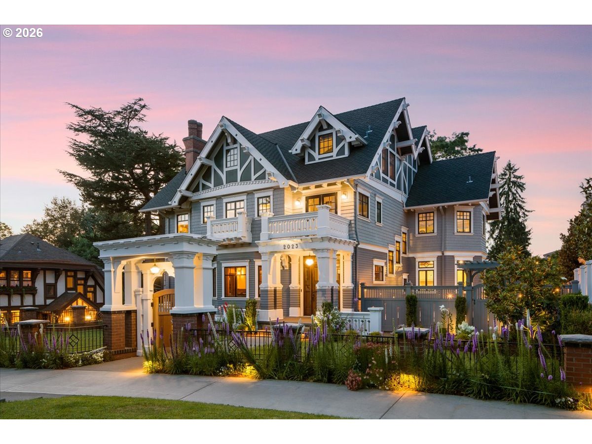 a front view of a residential apartment building with a yard