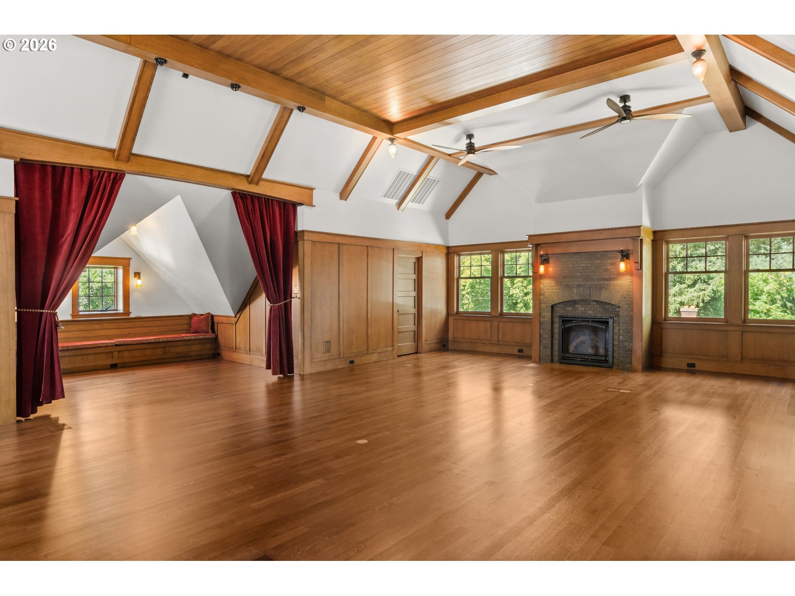 2023 Southwest Montgomery Drive Portland, OR 97201 - Photo 26 of 46 a view of an empty room with wooden floor and a window