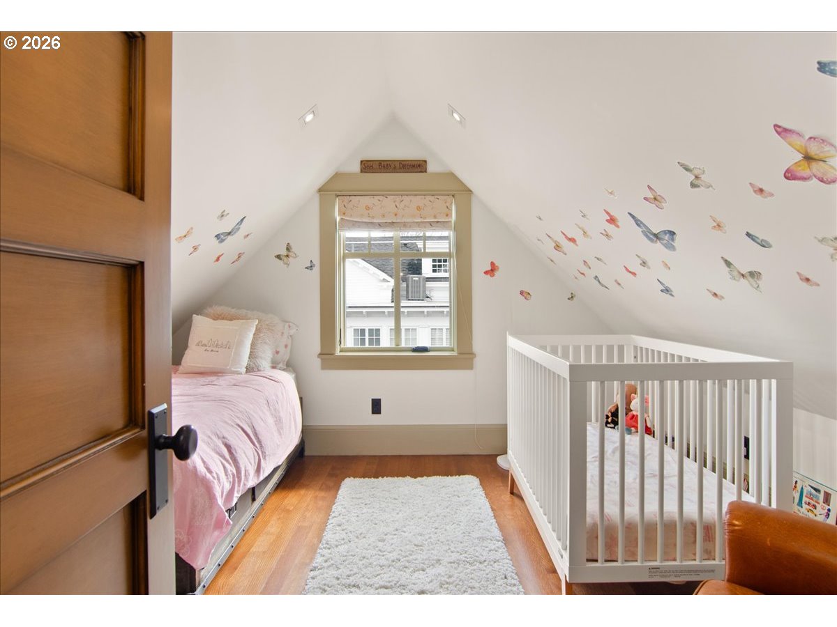 2023 Southwest Montgomery Drive Portland, OR 97201 - Photo 27 of 46 a bedroom with a bed and a window