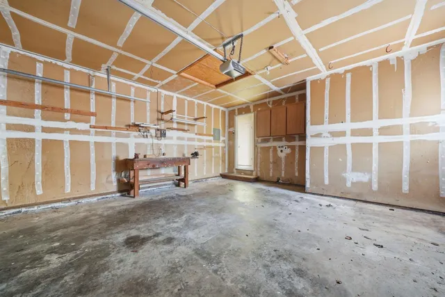 a view of a room with wooden walls