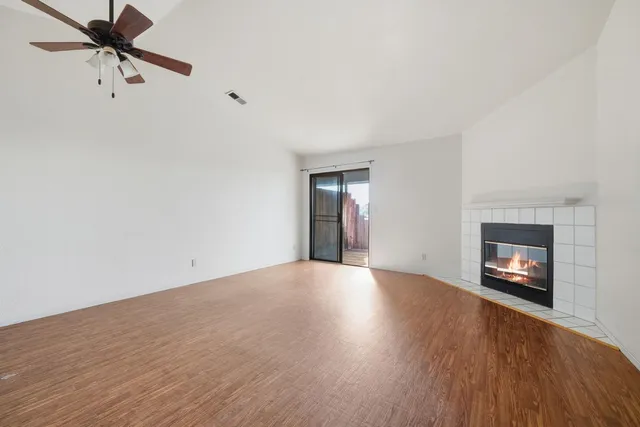 a kitchen with white cabinets and appliances
