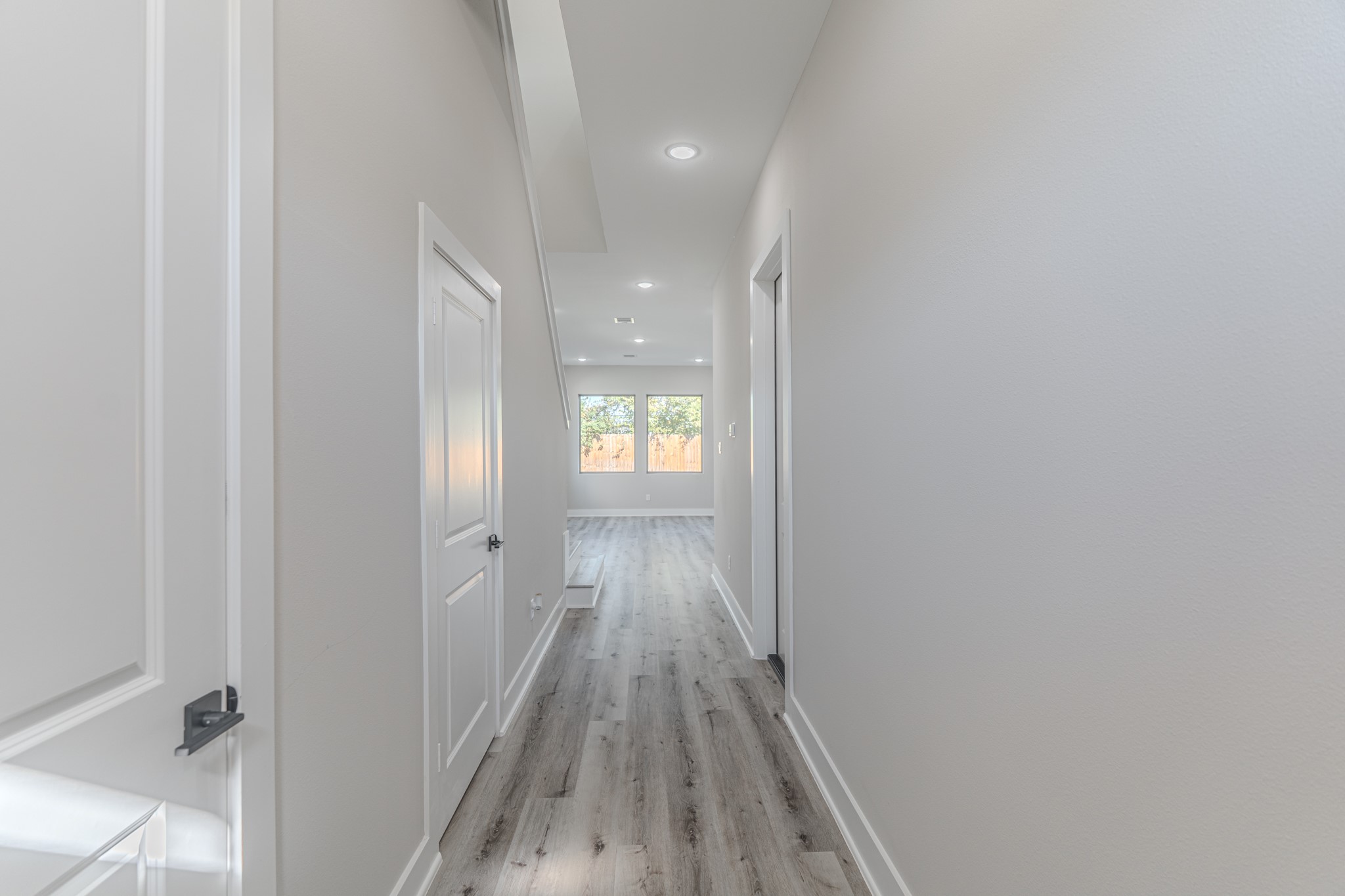 4910 Wunder Way Houston, TX 77069 - Photo 14 of 49 a view of a hallway with wooden floor and a bathroom