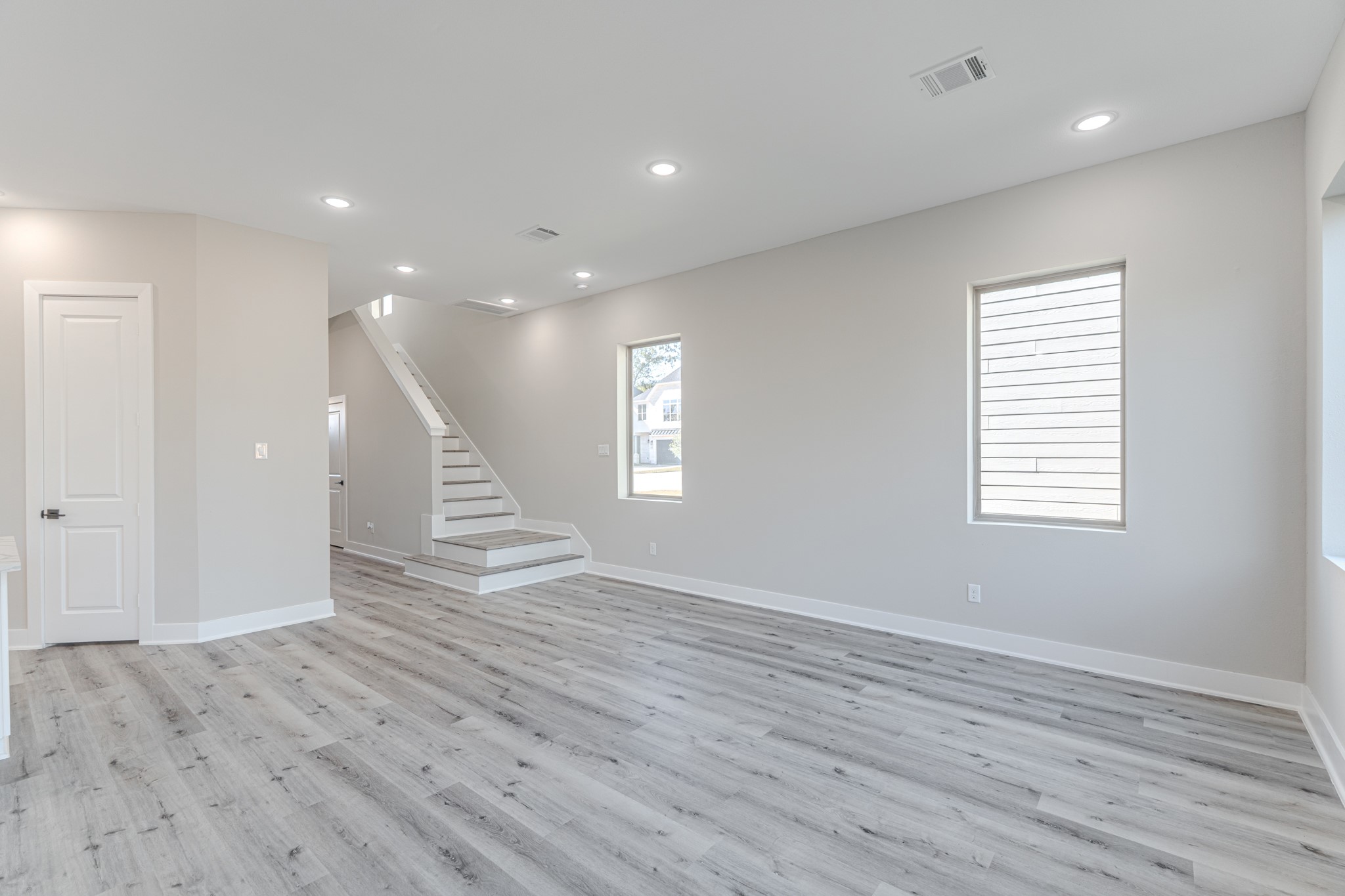 4910 Wunder Way Houston, TX 77069 - Photo 18 of 49 an empty room with wooden floor and windows