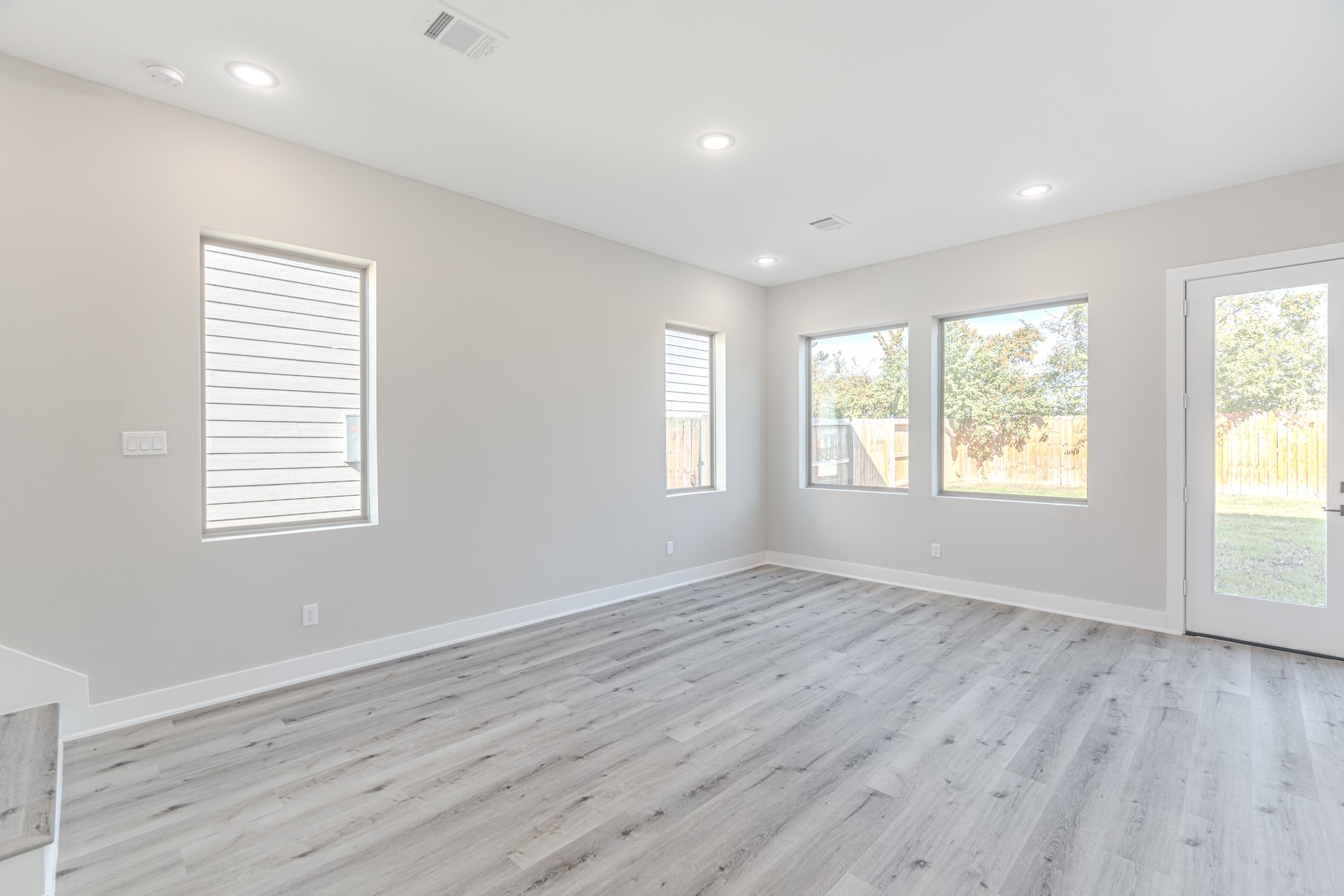 4910 Wunder Way Houston, TX 77069 - Photo 19 of 49 a view of an empty room with wooden floor and a window