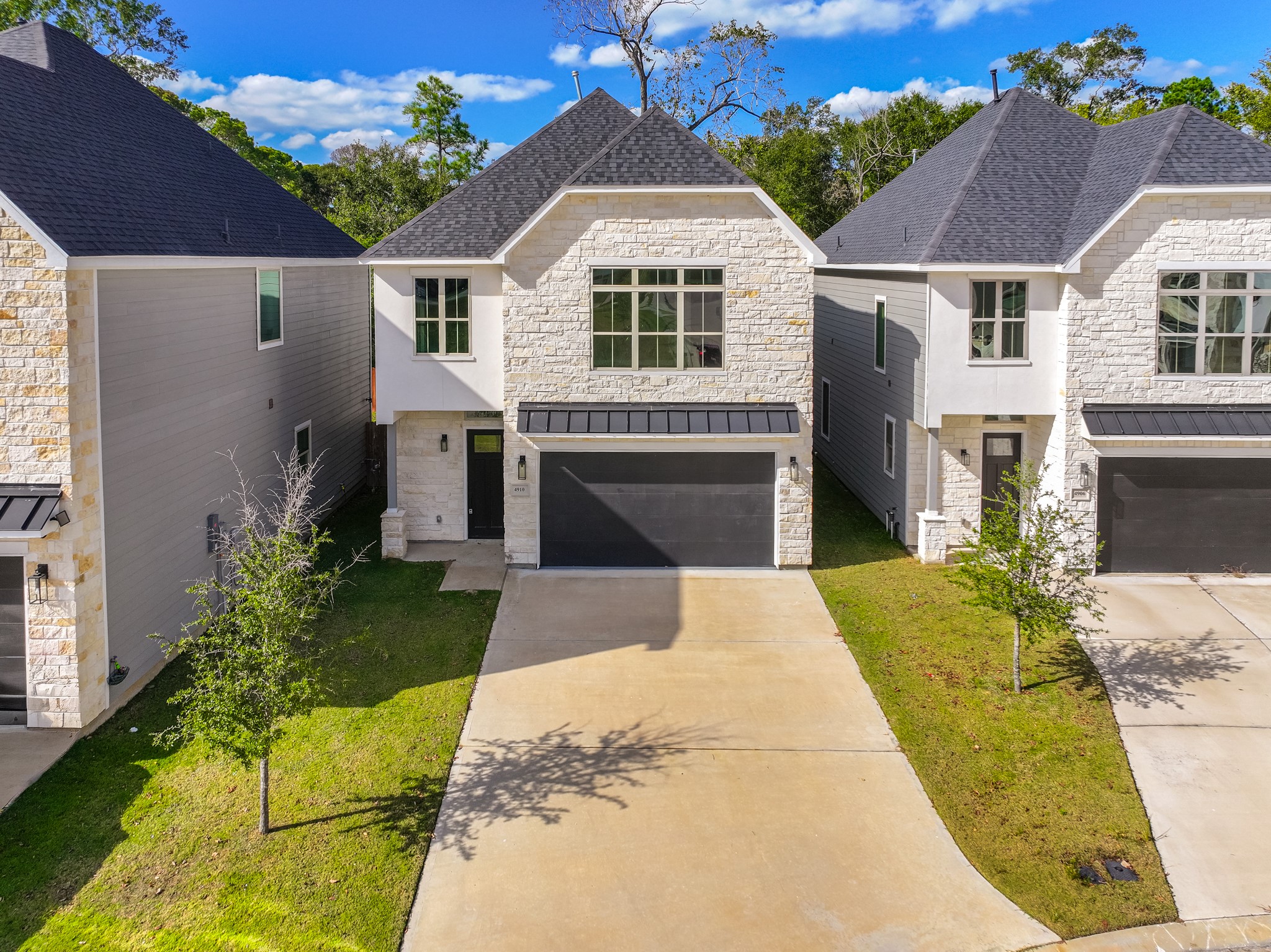 4910 Wunder Way Houston, TX 77069 - Photo 2 of 49 a front view of a house with a yard
