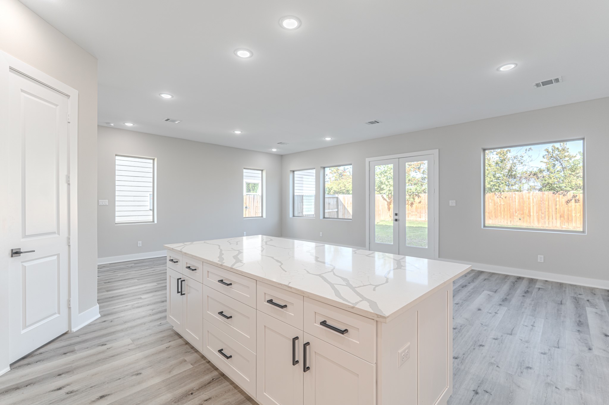 4910 Wunder Way Houston, TX 77069 - Photo 24 of 49 a large white kitchen with granite countertop a large window