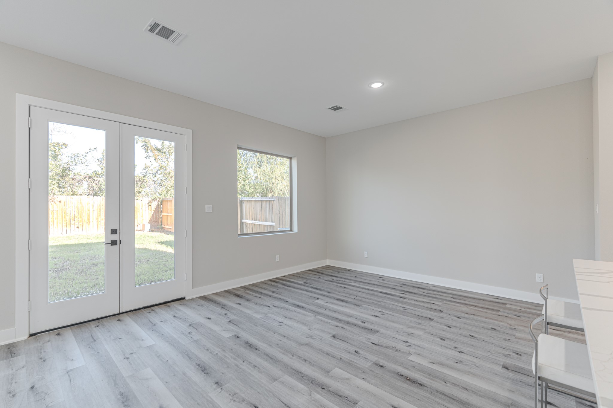 4910 Wunder Way Houston, TX 77069 - Photo 26 of 49 a view of an empty room with wooden floor and a window
