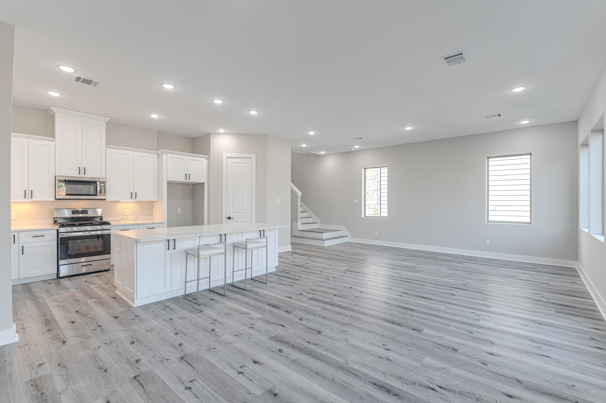 4910 Wunder Way Houston, TX 77069 - Photo 28 of 49 a view of kitchen with sink microwave refrigerator and stove