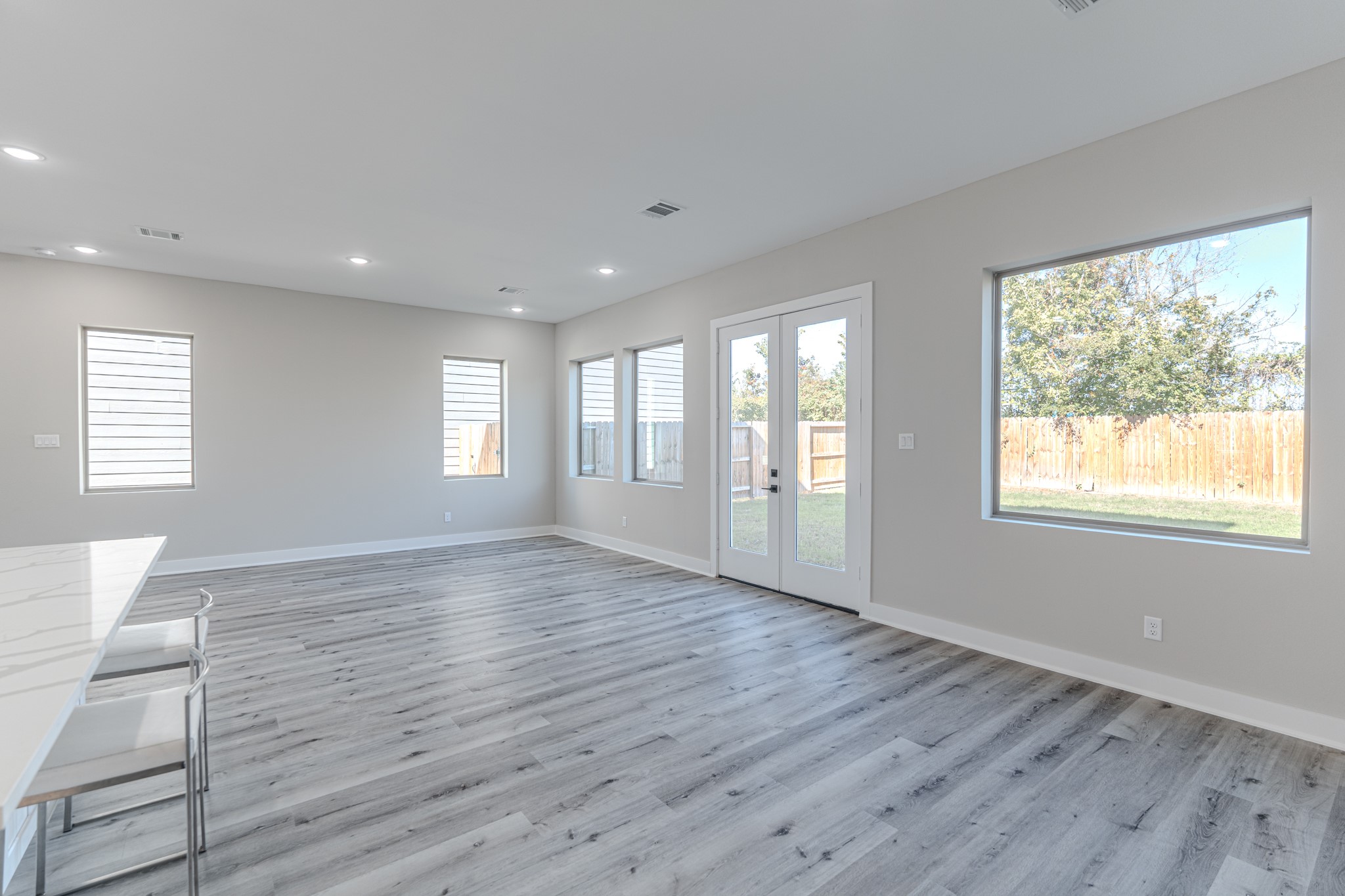 4910 Wunder Way Houston, TX 77069 - Photo 29 of 49 a view of an empty room with wooden floor and a window