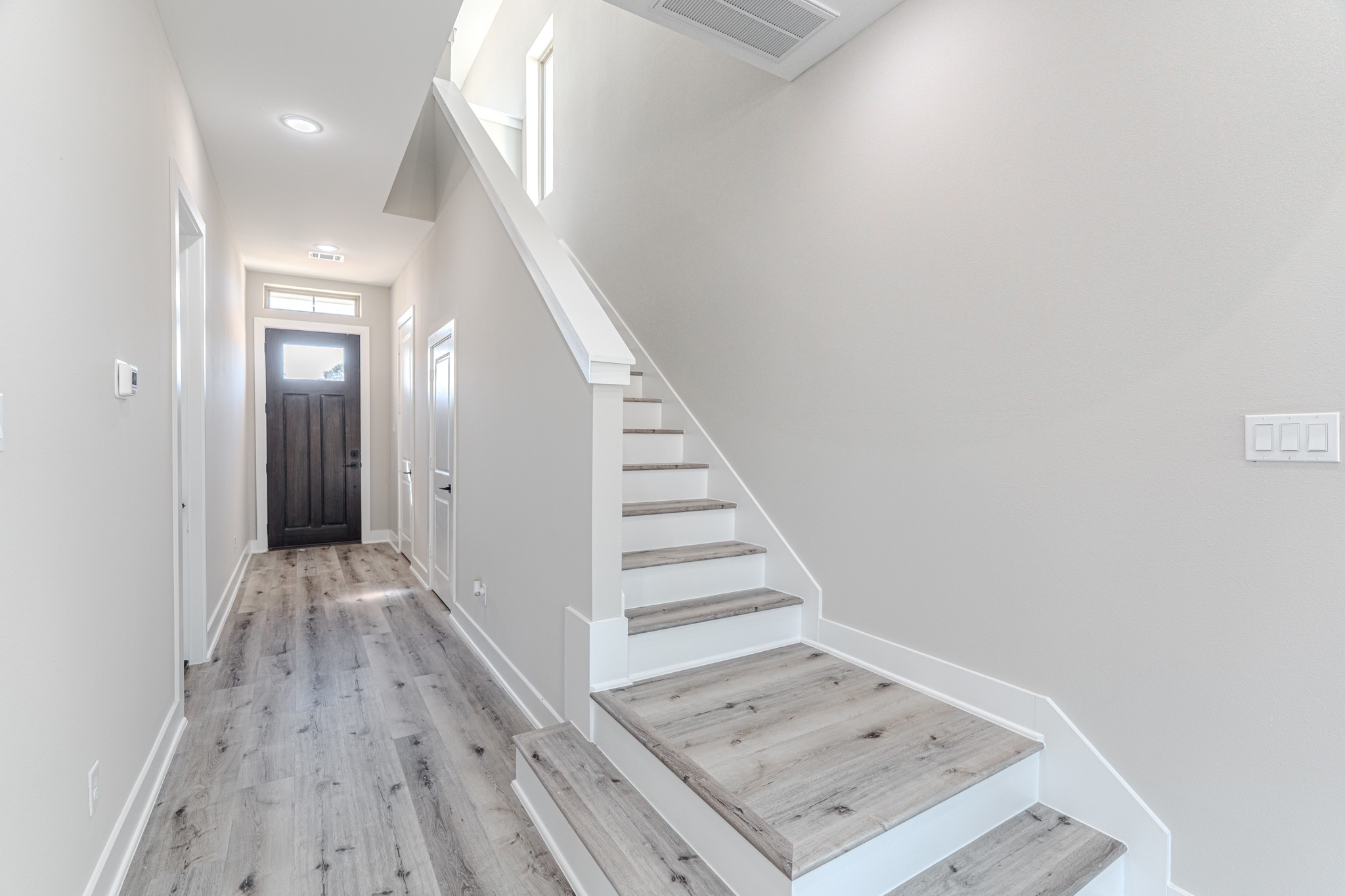 4910 Wunder Way Houston, TX 77069 - Photo 30 of 49 a view of a hallway view with wooden floor and staircase