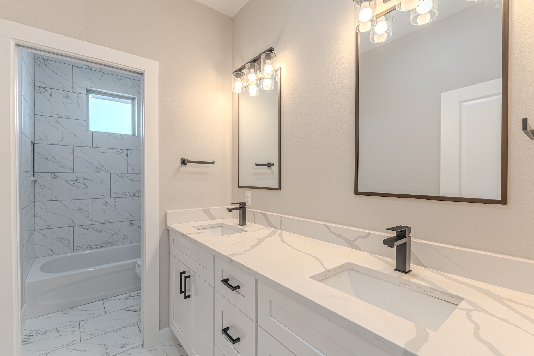 4910 Wunder Way Houston, TX 77069 - Photo 42 of 49 a bathroom with a sink double vanity and a mirror