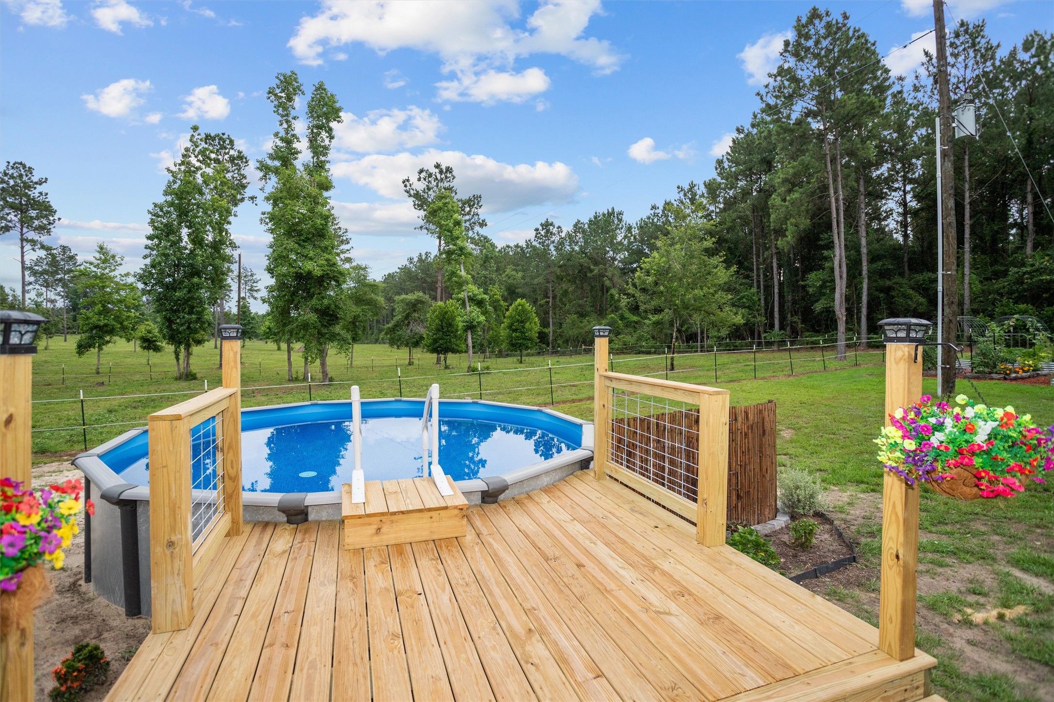 275 County Road 3215 Colmesneil, TX 75938 - Photo 12 of 34 swimming pool view with a garden space