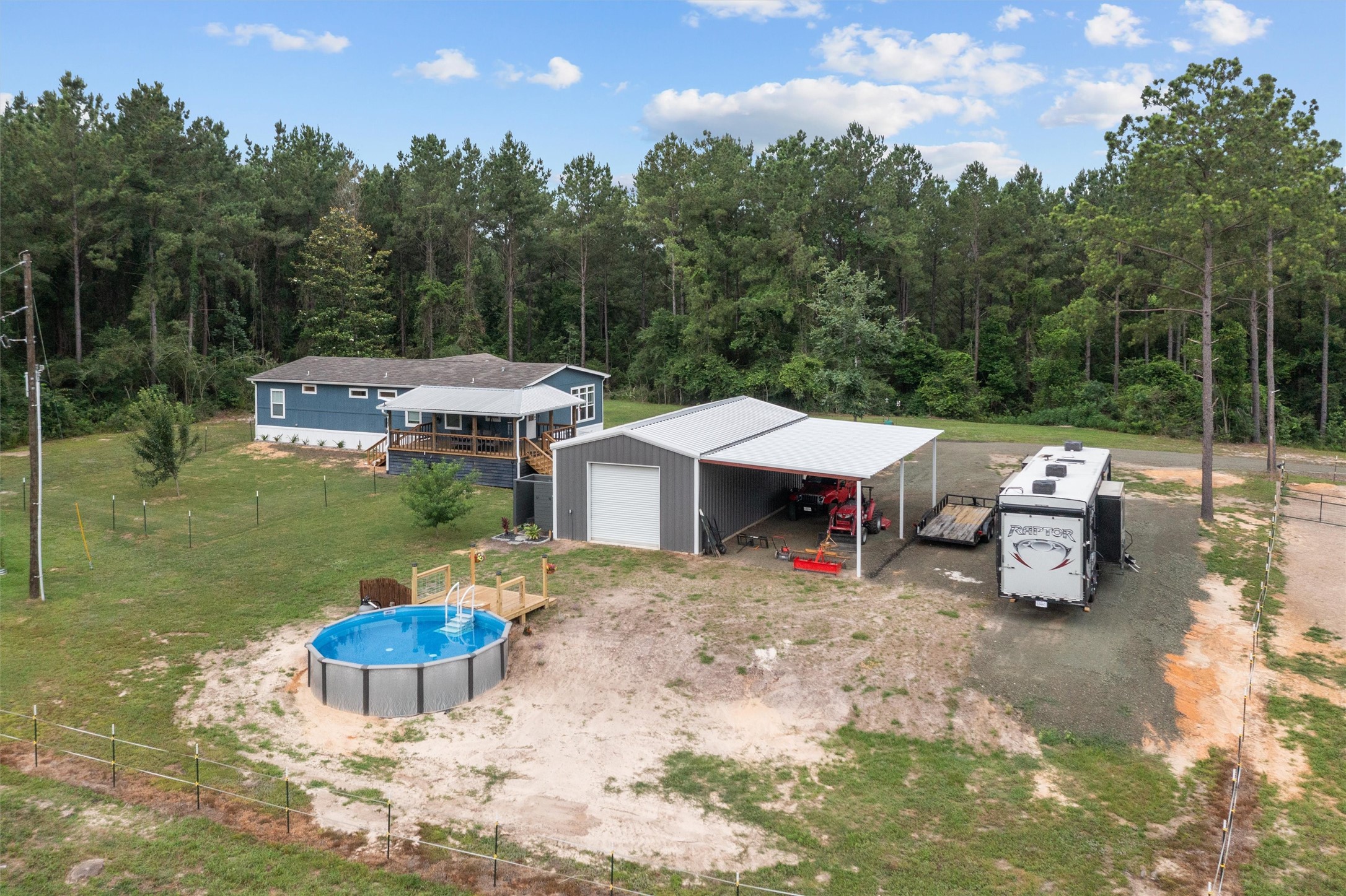 275 County Road 3215 Colmesneil, TX 75938 - Photo 20 of 34 a view of a backyard with sitting area and fire pit