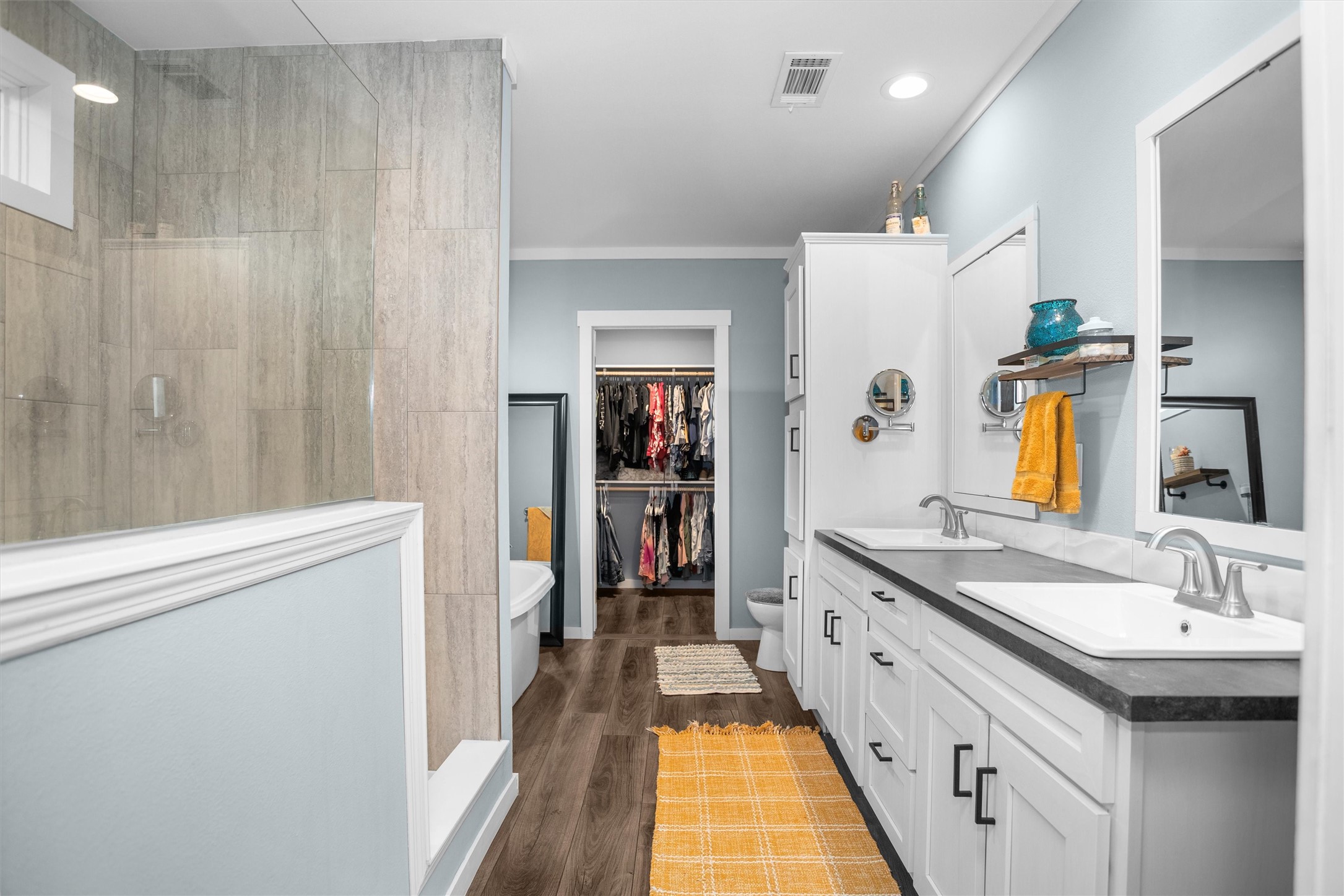 275 County Road 3215 Colmesneil, TX 75938 - Photo 21 of 34 a spacious bathroom with a double vanity sink and a mirror