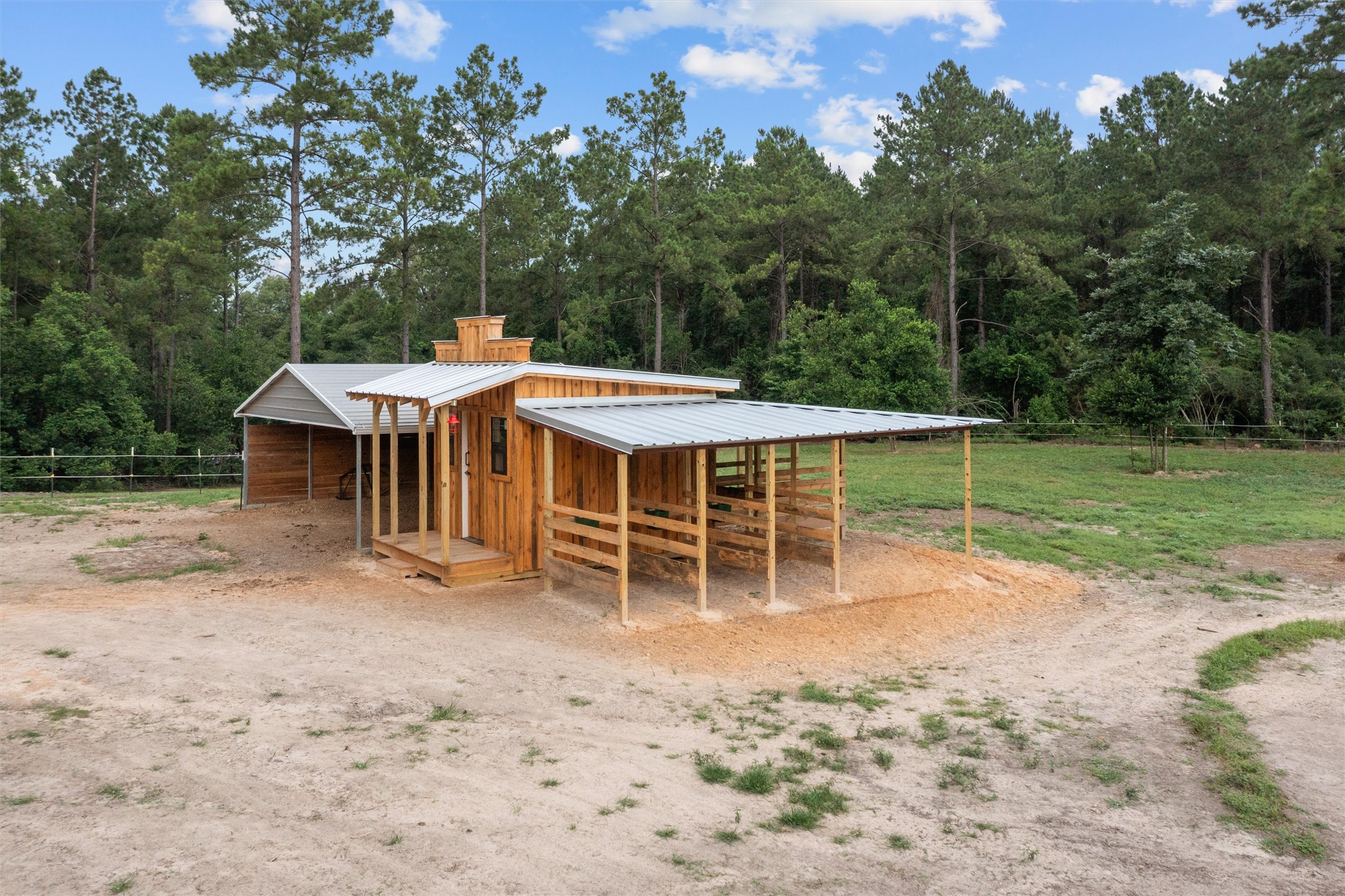 275 County Road 3215 Colmesneil, TX 75938 - Photo 22 of 34 a backyard of a house with table and chairs