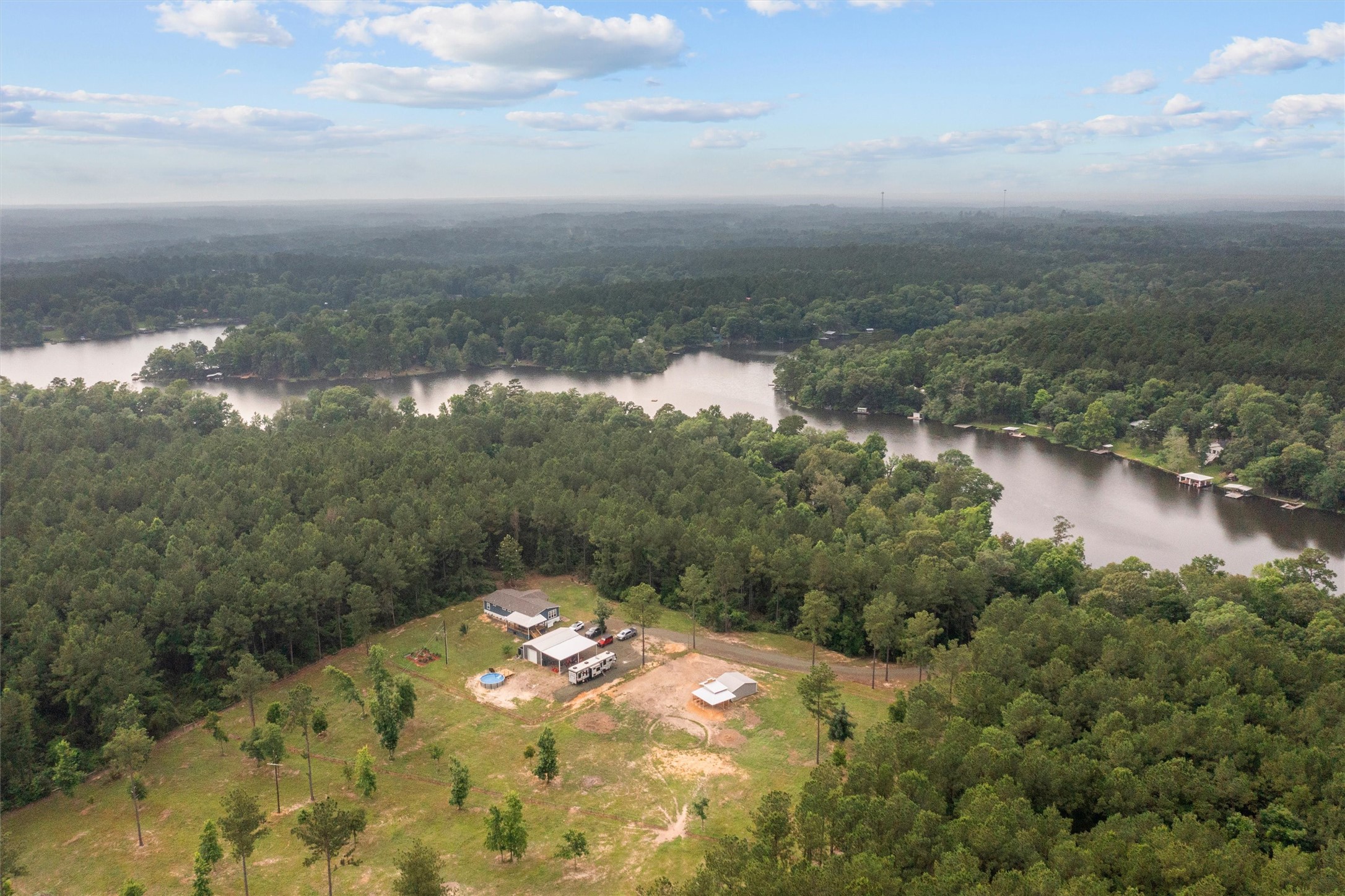 275 County Road 3215 Colmesneil, TX 75938 - Photo 24 of 34 a view of a lake in between two of trees