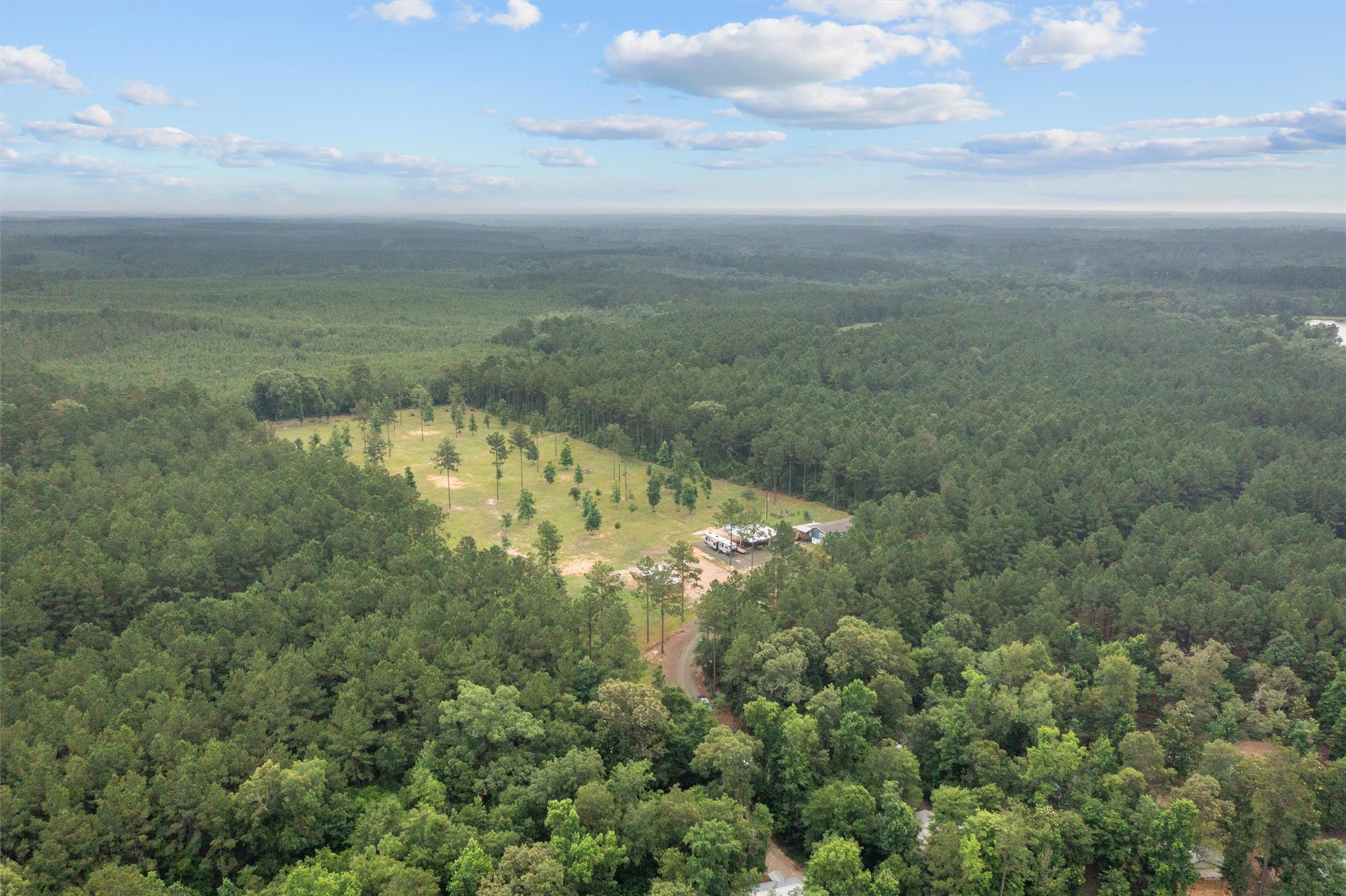 275 County Road 3215 Colmesneil, TX 75938 - Photo 28 of 34 a view of a lake with a yard