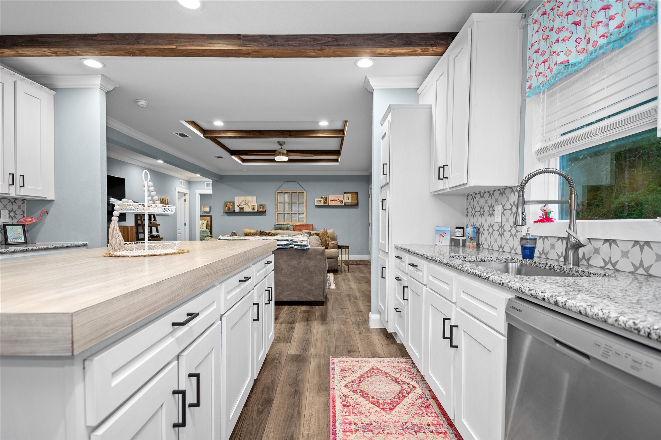 275 County Road 3215 Colmesneil, TX 75938 - Photo 9 of 34 a large kitchen with stainless steel appliances granite countertop a lot of counter space and wooden floors