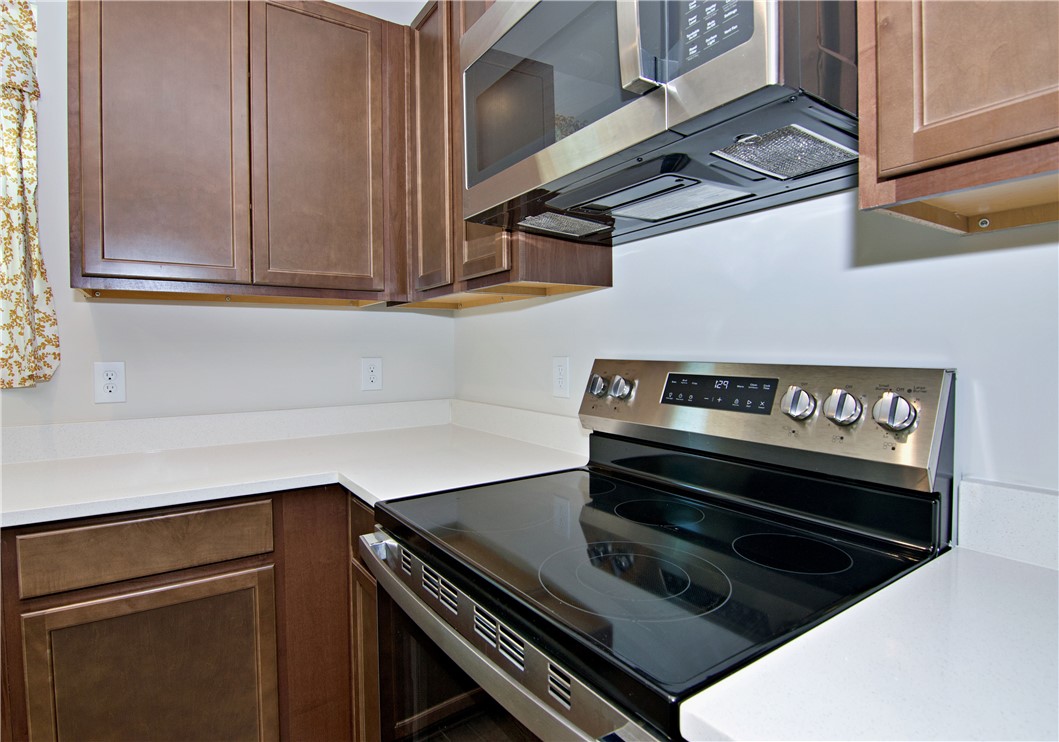 723 Peridot Way Westminster, SC 29693 - Photo 11 of 45 Culinary delights await in this modern kitchen, featuring sleek countertops and contemporary appliances.