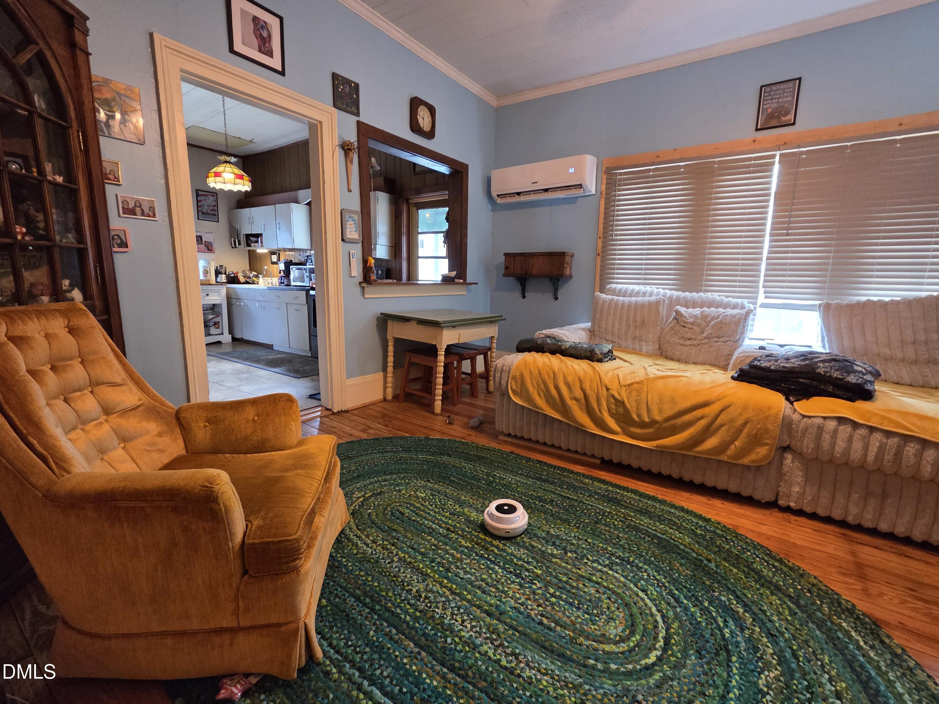 812 West Anderson Street Selma, NC 27576 - Photo 10 of 20 a living room with furniture a rug and a window