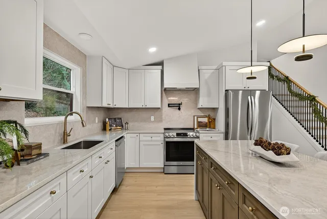 a kitchen with a sink a stove and cabinets