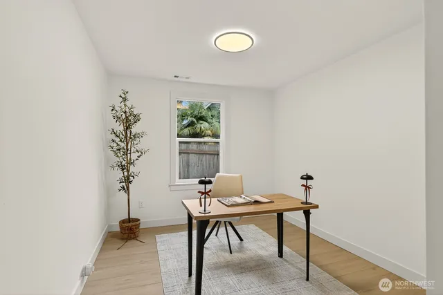 a workspace with furniture and window