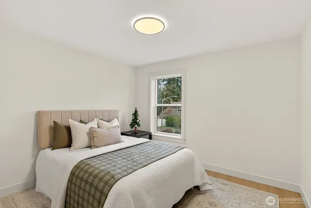 a bathroom with a sink a toilet a tub and shower