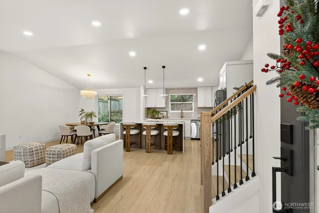 a living room with furniture dining room and a chandelier