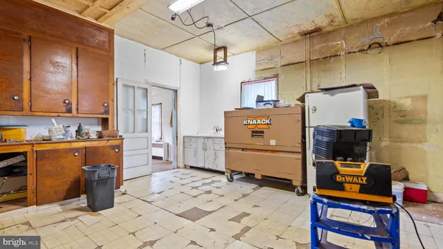 a room with a dresser and a mirror