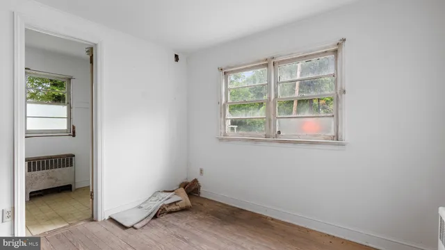 a view of hall way with seating space